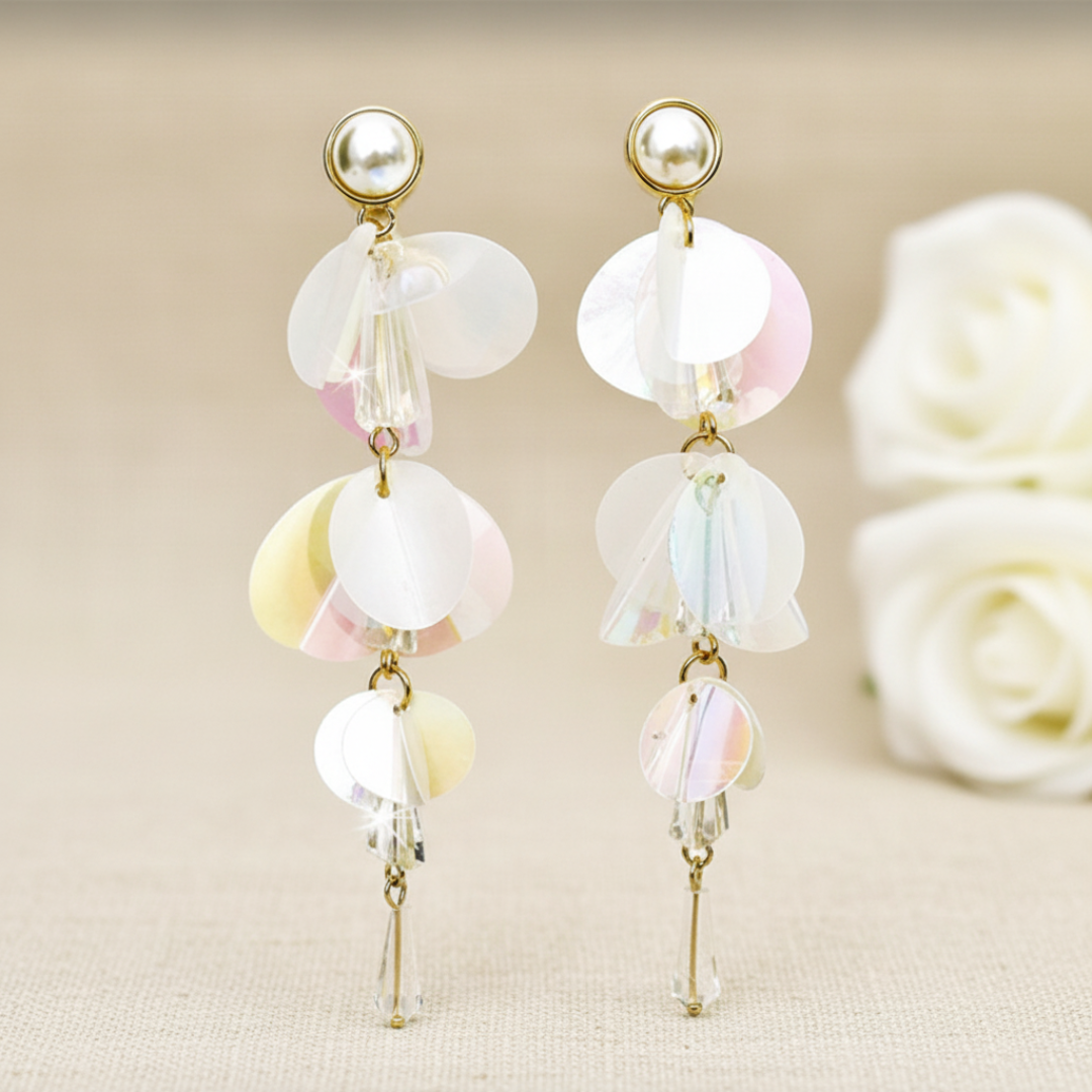 Long iridescent fashion earrings featuring white pearls and clear crystal accents. Visit Arlana Exquisite Styles for purchase.