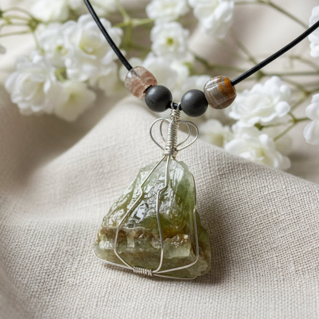 Green Amethyst Necklace with Turkish Glass Beads. Amethyst is wrapped in silver wire and suspended from a black leather cord.