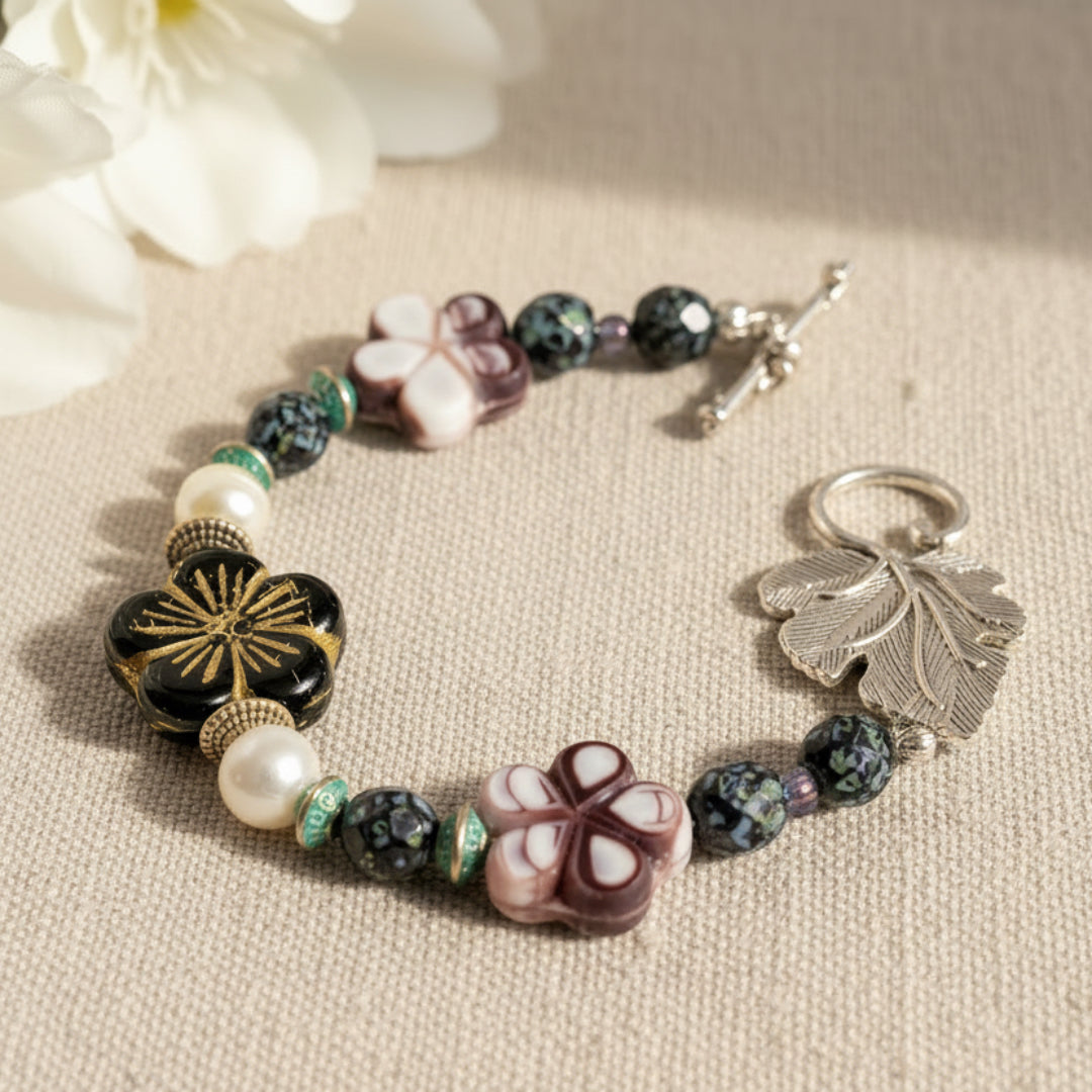 Bracelet with floral and leaf designs. Handmade in Canada by Arlana Exquisite Styles.