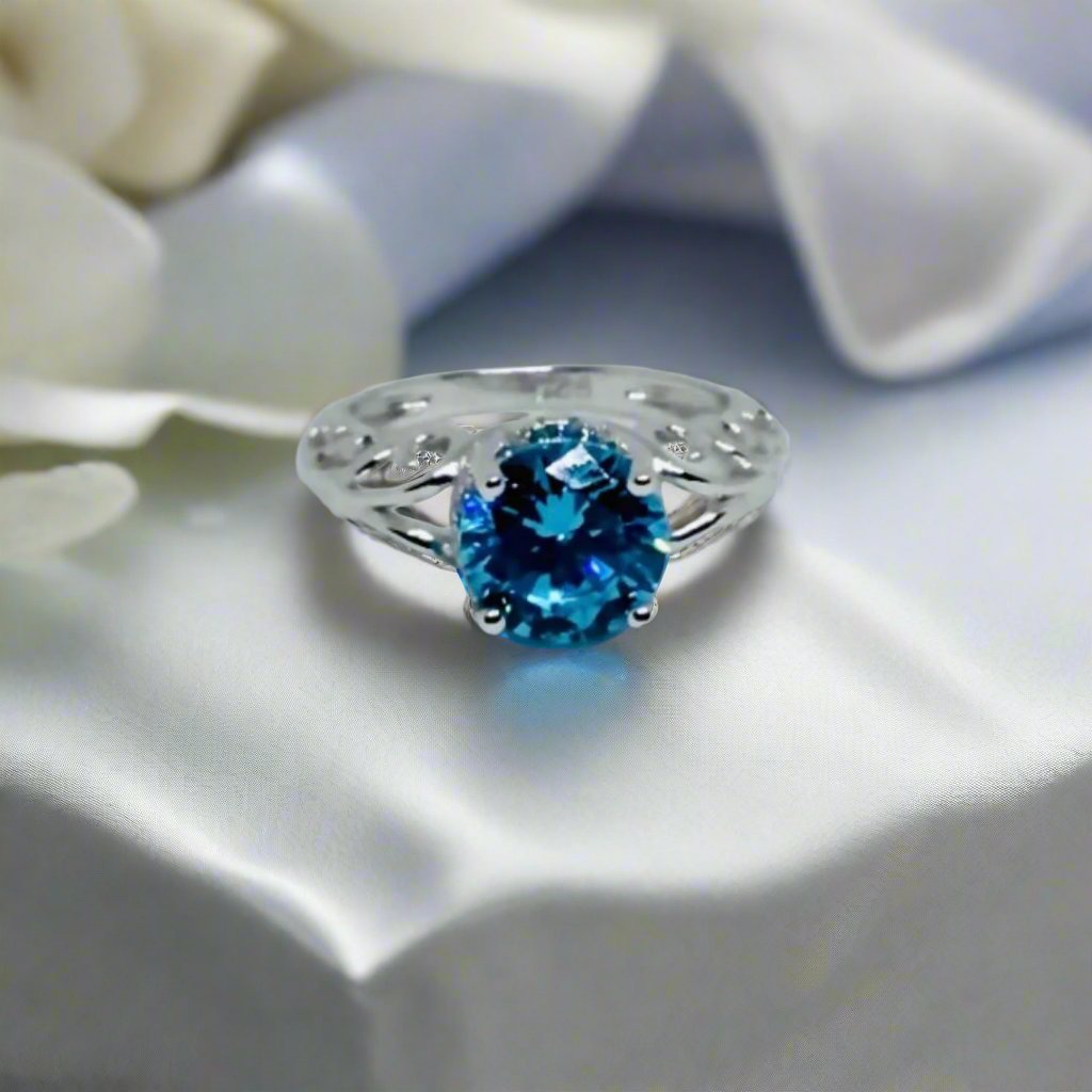 blue laboratory created topaz set in sterling silver ring