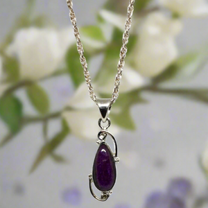 sugilite pendant set in sterling silver with deep plum colour