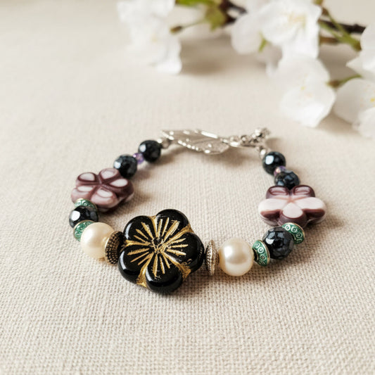Bracelet with decorative beads on a textured surface
