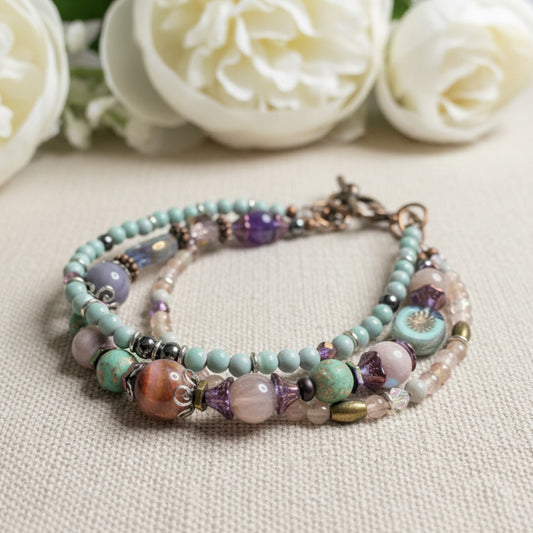 Multistrand beaded bracelet with various colored beads on a textured surface